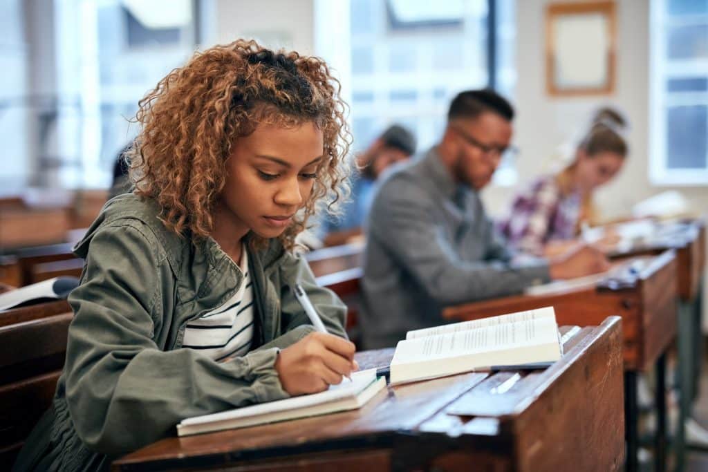 Student studying in a classroom at a desk