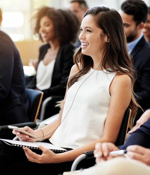 Shot of a group of businesspeople attending a conference